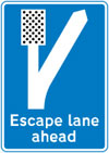 Escape lane ahead for vehicles unable to stop on a steep hill